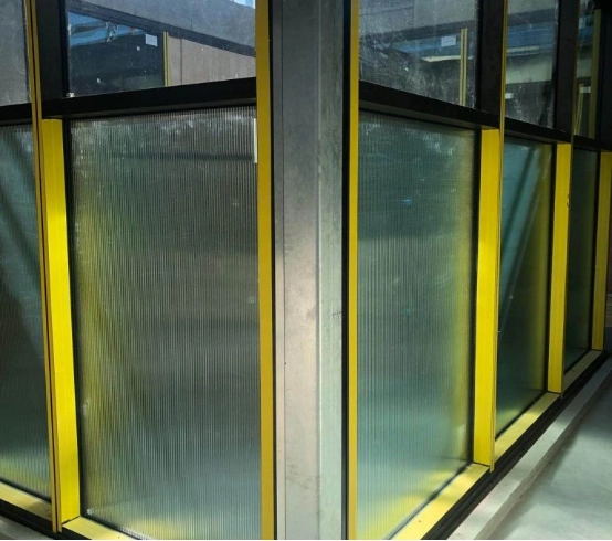 framed-glazing-building-corner-yellow-lower-panels
